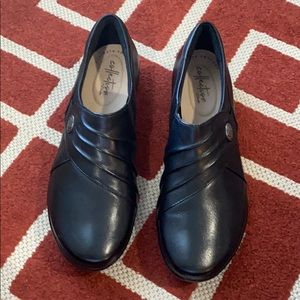Black leather slip shoes